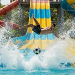 Astonishing Sight at Water Park: Man Slips From Slide, Then Flies Mid-Air and Delivers a Spectacular Kick on a Football – Watch Viral Video