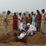 Mother kills newborn over third daughter; Body exhumed on DM's orders for post-mortem.