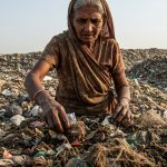 Woman extracting condoms from garbage performs bizarre act, people enraged after watching video.