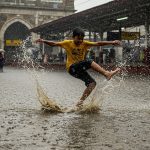 Viral Video: Boy's Unique Style Tumbling in Water Outside Railway Station, Where is This Scene From?
