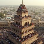 Crowd Swarms Tower: The City's Amazing Spectacle, But Was the Danger Priceless?